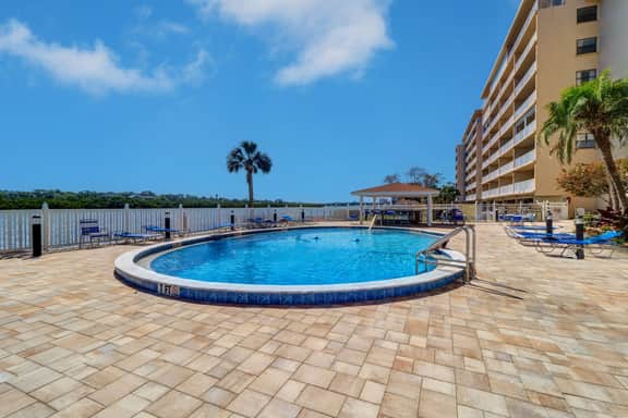 Elegant condo with water view near beach pool and hot tub fast WiFi and AC