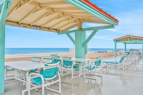 Beachfront studio with grilling area and shuffleboard steps to sand