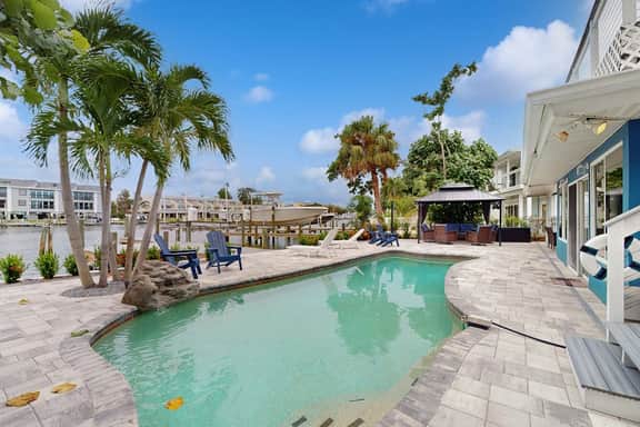 Waterfront home with private pool deck and patio 1/2 mile to the beach
