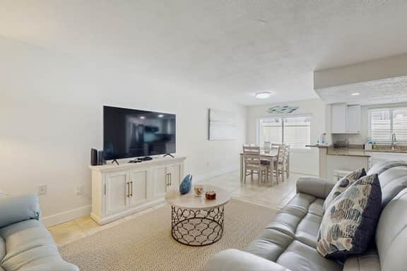 Ground floor getaway with a heated pool and central AC walk to the beach