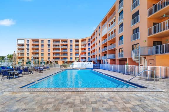 Beachfront condo with pool tennis court and AC Dog friendly