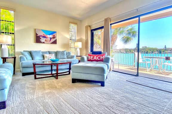 Coastal condo with multiple balconies and dock intracoastal waterway views