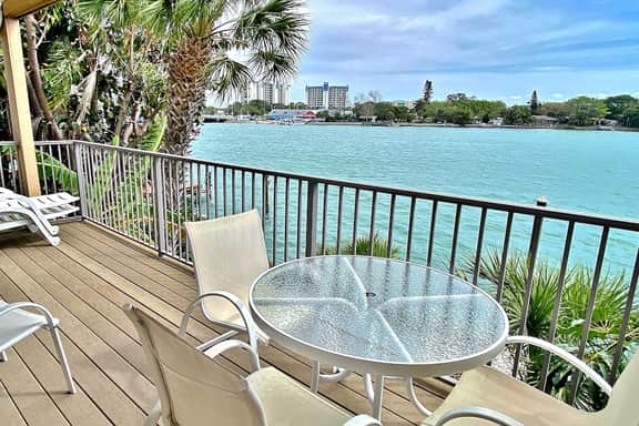 Coastal condo with multiple balconies and dock intracoastal waterway views
