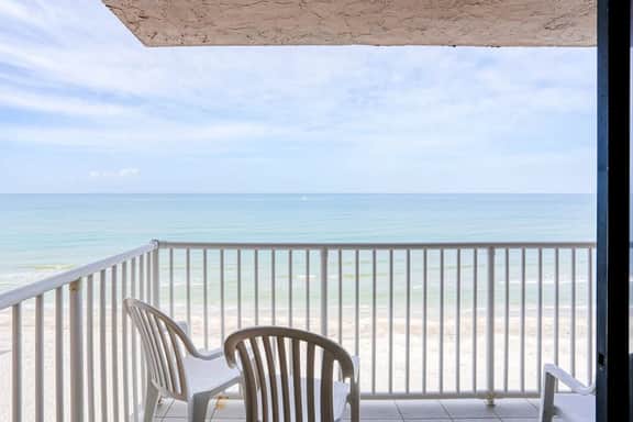 Delightful waterfront condo with sweeping views beach access balcony and pool