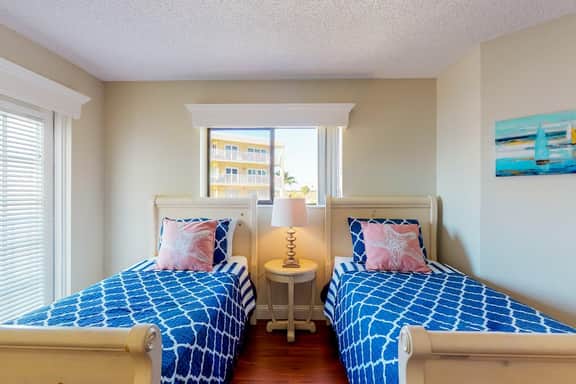 Sunny beachfront condo with pool access to beach attractions