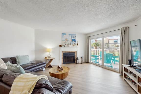 Modern cottage with peek a boo side Gulf view and beachfront heated pool and spa