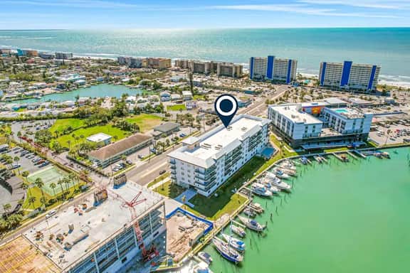 Brand new condo steps to beach with balcony heated pool and hot tub dog friendly