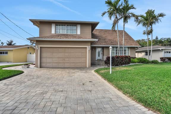 Snowbird friendly elegant home with waterfront location pool grill fireplace