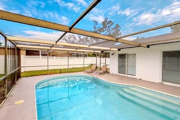 Bright and open home with private pool screened lanai enclosed yard and WD