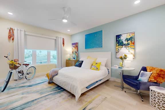 Sunlit and colorful beach condo with heated pool hot tub and balcony near shore and shops
