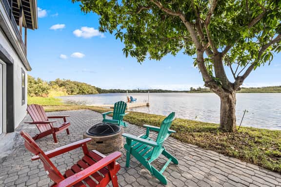Sprawling river view estate with game room dock kayaks grill and fishing gear - Image 3