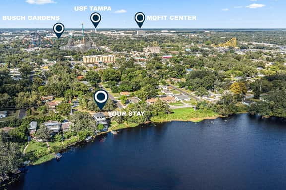 Sprawling river view estate with game room dock kayaks grill and fishing gear - Image 2
