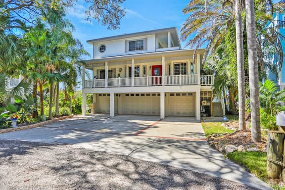 Luxurious waterfront home with pool game room dock