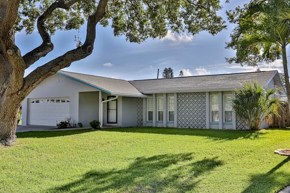 Modern coastal getaway with pool enclosed yard grill and outdoor bar