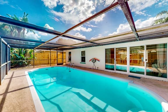 Coastal home with pool lanai patio and fireplace