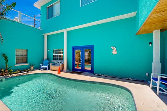 Treasure Island paradise with pool and Gulf view deck steps to Sunset Beach