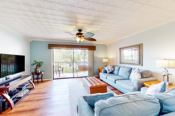 Beachfront condo with balconies grill AC and pool access steps from the sand