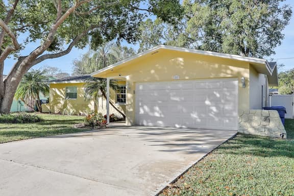 Stunning centrally located home with enclosed yard patio grill WD and AC