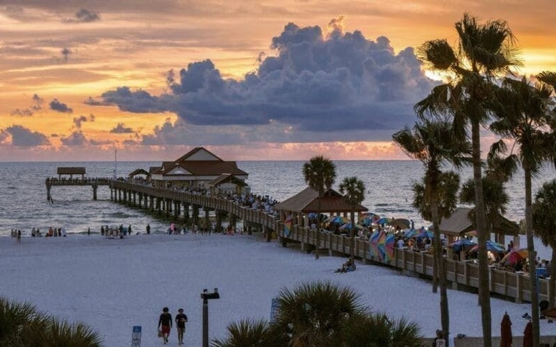 Pier 60 at Clearwater Beach at sunset with palm trees