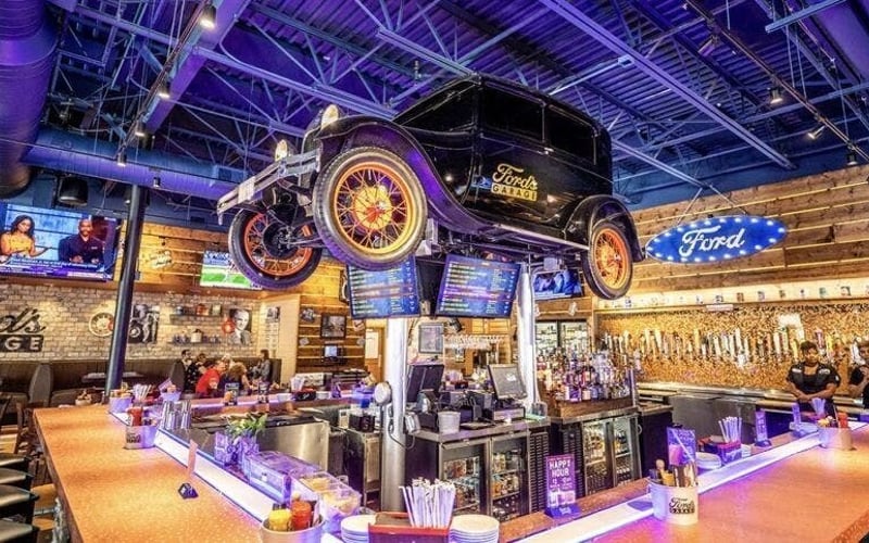 Ford's Garage bar interior with vintage Model T suspended from the ceiling