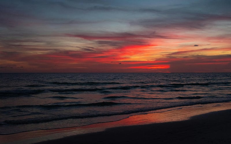 Sunset over St. Pete Beach with waves on the Gulf shore