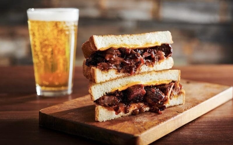 BBQ brisket melt sandwich with a cold beer at Ford's Garage