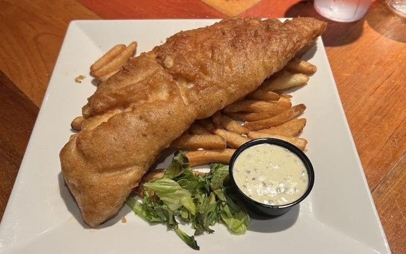 Beer-battered fish and chips with tartar sauce at Ford's Garage